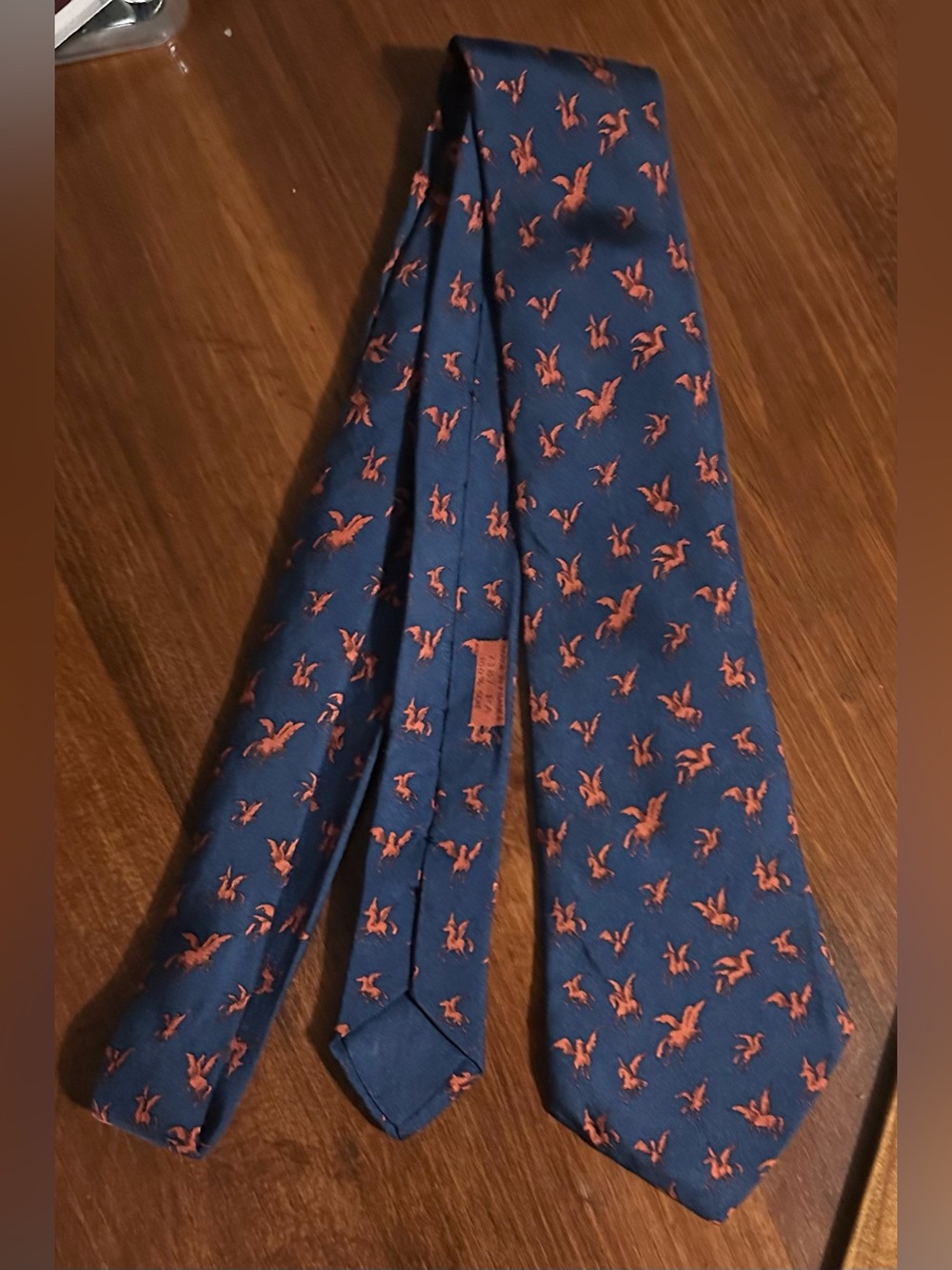 Hermes Navy Tie with Orange flying horse Motif